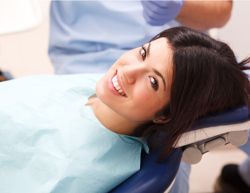 Young female patient sitting on chair in dental office.preparing